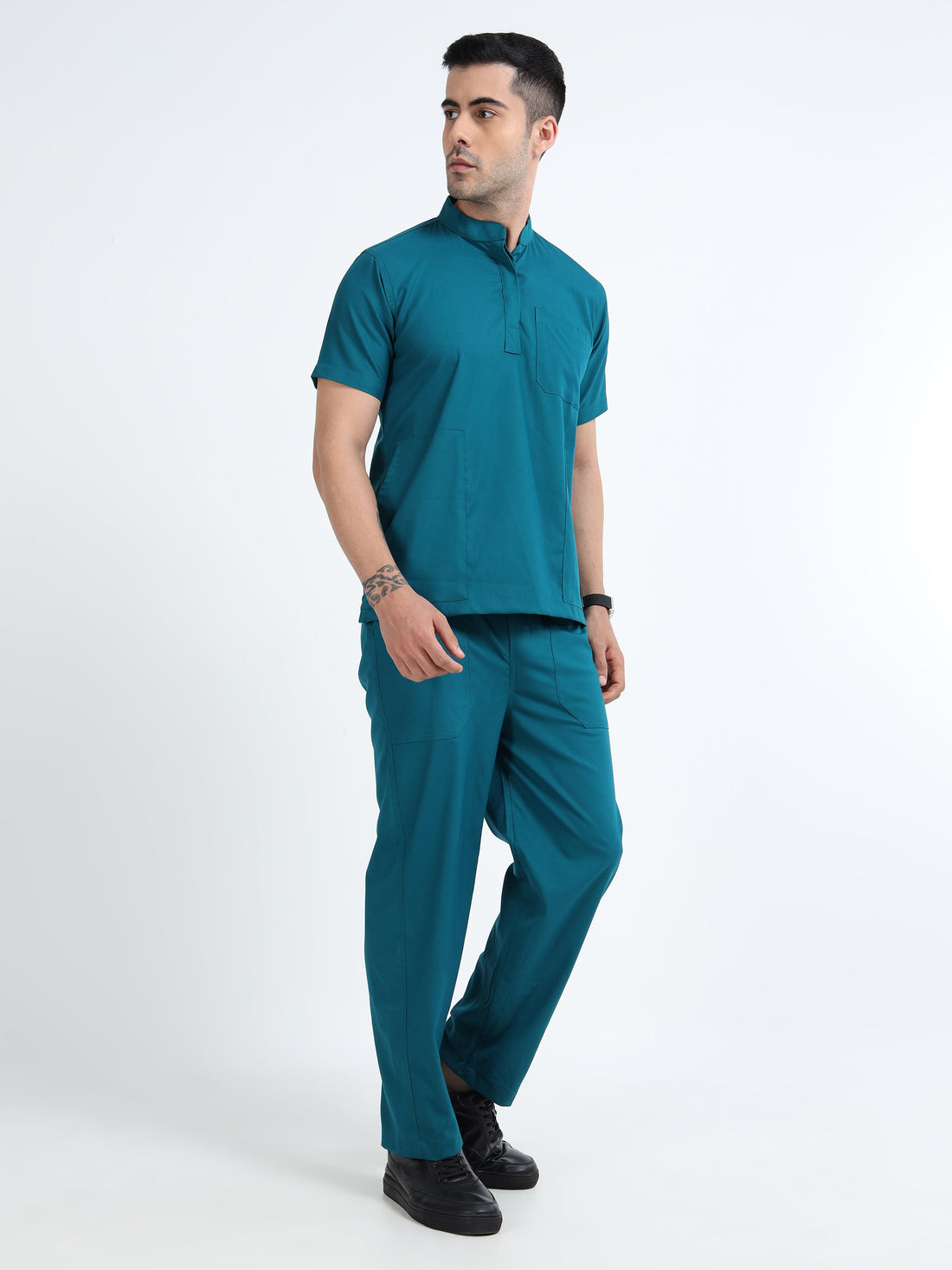 Male doctor selecting Scrubmode medical scrub set online